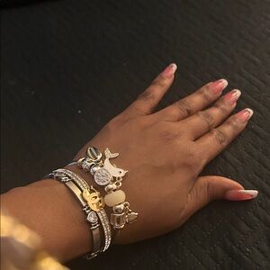 Elegant Gold and Silver Charm Bracelet